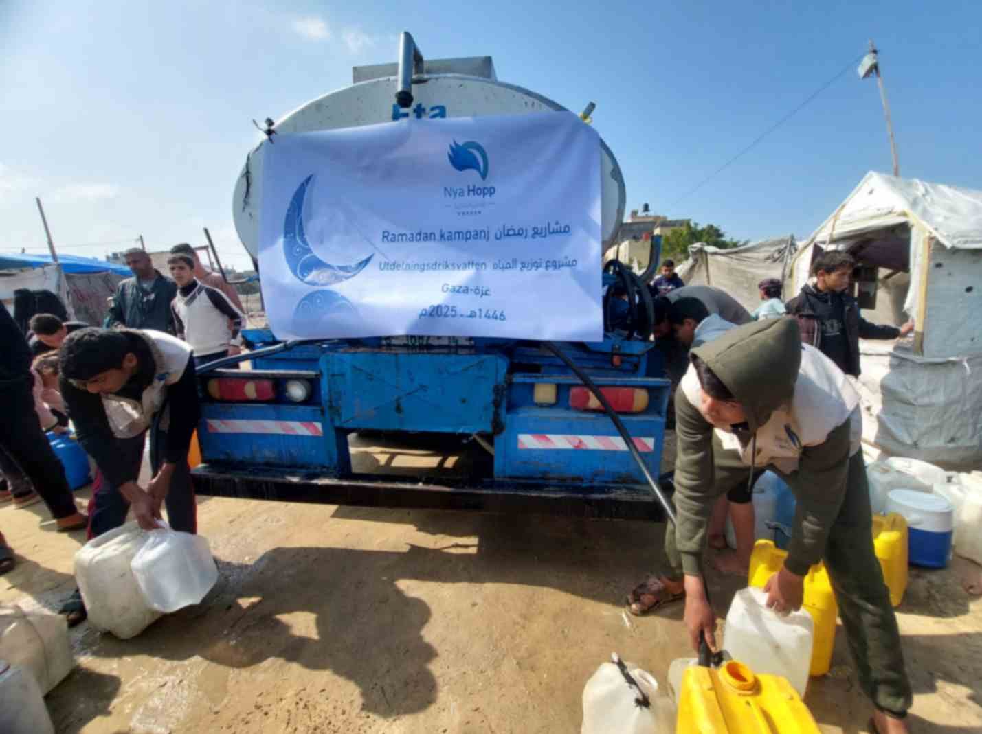 Water crisis in Gaza – families with empty containers due to lack of clean drinking water.