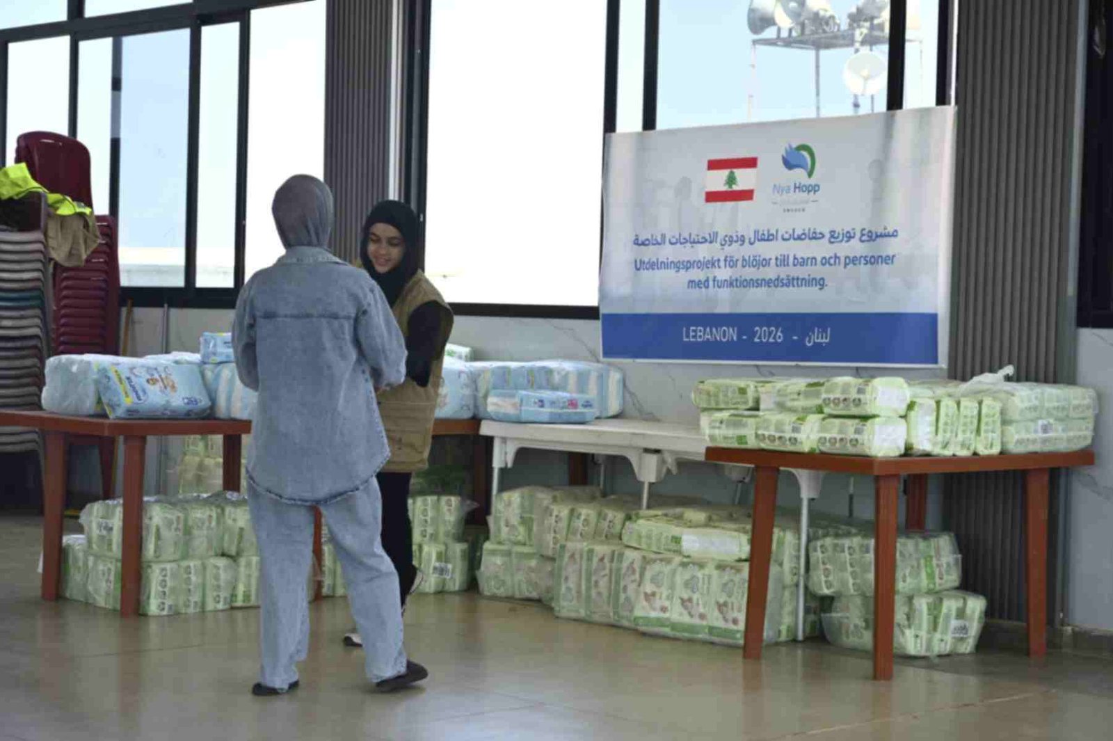 Nya Hopp volunteers preparing diapers and hygiene aid boxes for distribution in Lebanon